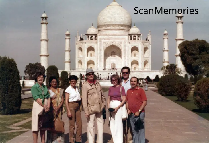 The same family photograph after ScanMemories digitisation — colours restored, sky and marble clear again